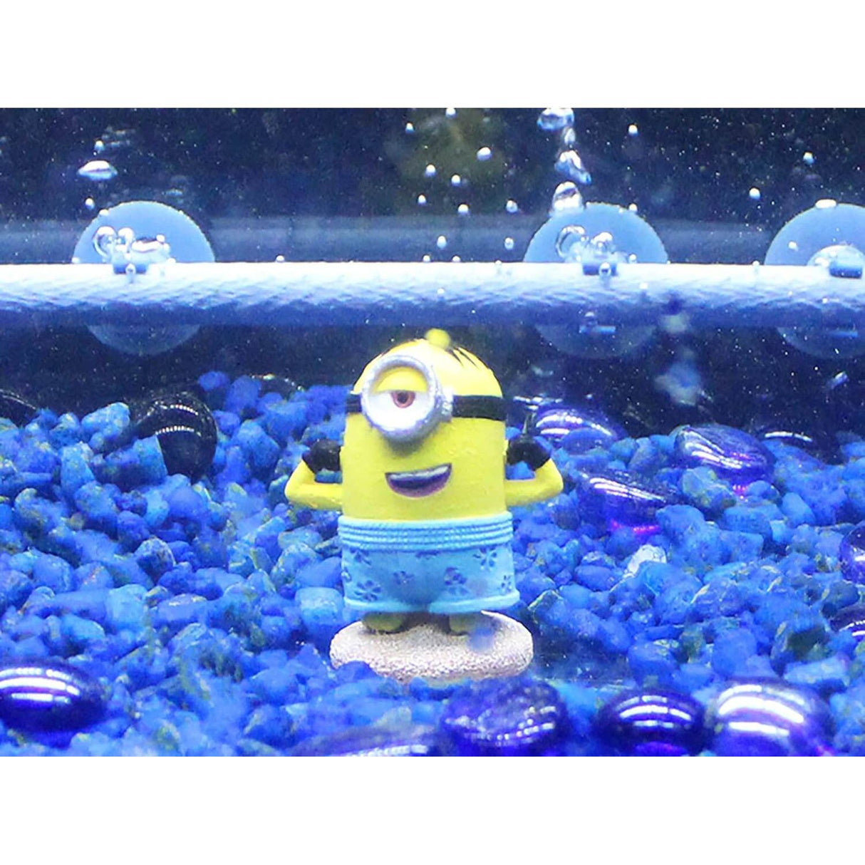 Penn-Plax Minions Officially Licensed Kevin minion figure in aquarium with blue gravel and bubbles.