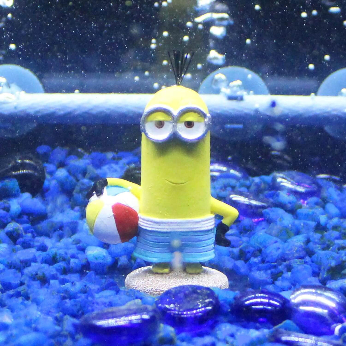 Penn-Plax Minions Officially Licensed beach-themed aquarium ornament featuring a Minion holding a beach ball.