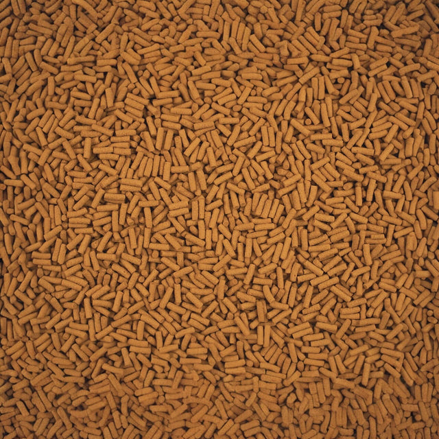 Close-up of Tetra Cichlid Sticks, a high-quality staple food for cichlids and large ornamental fish.