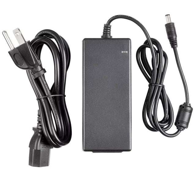 Black power supply unit with cables for electronic devices, including plug and connector.