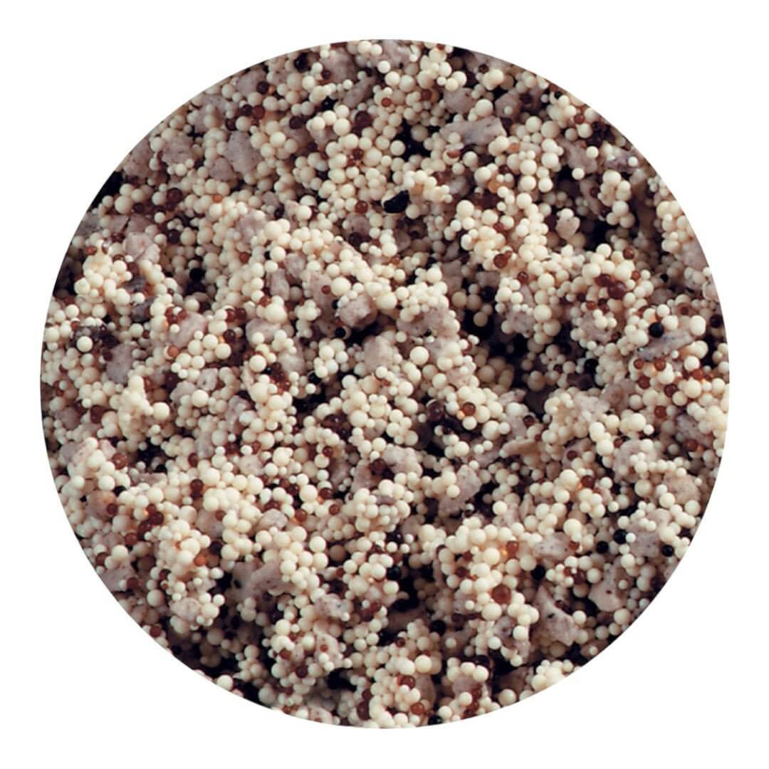 Close-up of API Nitra-Zorb filtration media, showing natural and synthetic resin beads for aquarium filtration.