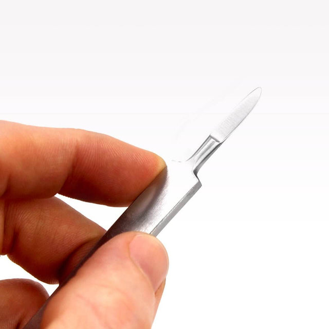 Close-up of a hand holding an Aquavitro surgical steel scalpel for fragging in aquariums.