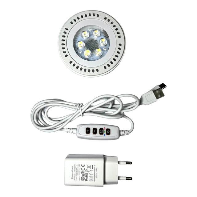 LED grow light with USB cable and power adapter for terrarium climate control.