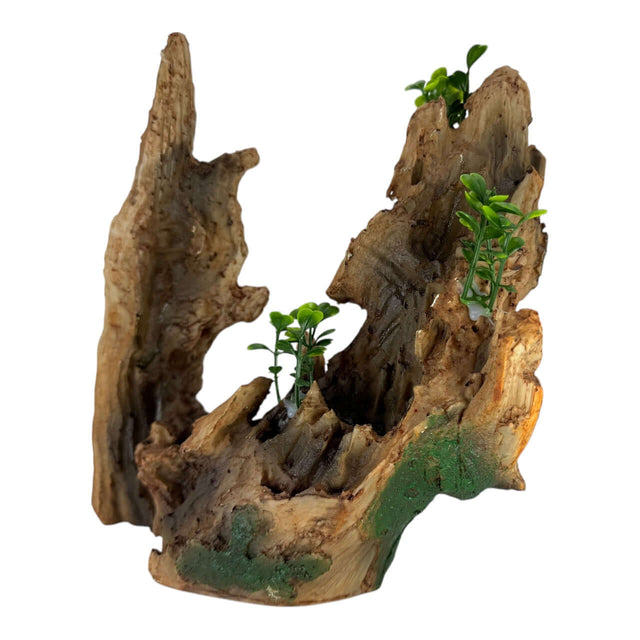 Hollow tree trunk aquarium ornament with greenery, resembling natural driftwood for aquascaping.