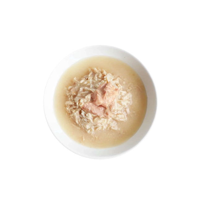 Bowl of Kit Cat Boneless Chicken Shreds and Salmon in broth, ideal for cats with sensitive stomachs.