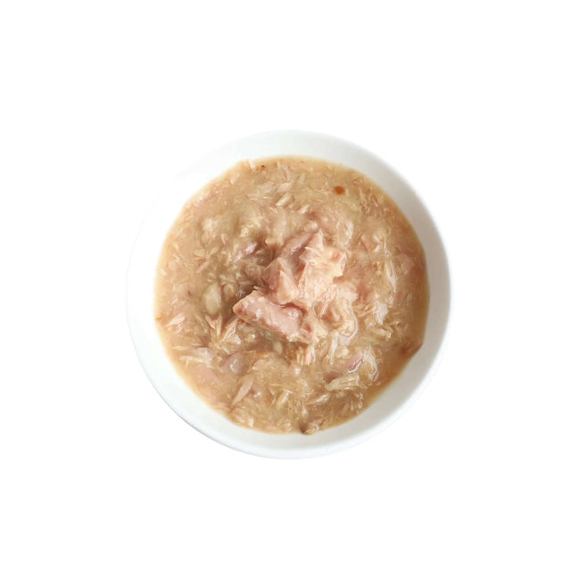 Bowl of Kit Cat White Meat Tuna Flakes and Salmon with Goat's Milk cat food, creamy texture for sensitive stomachs.