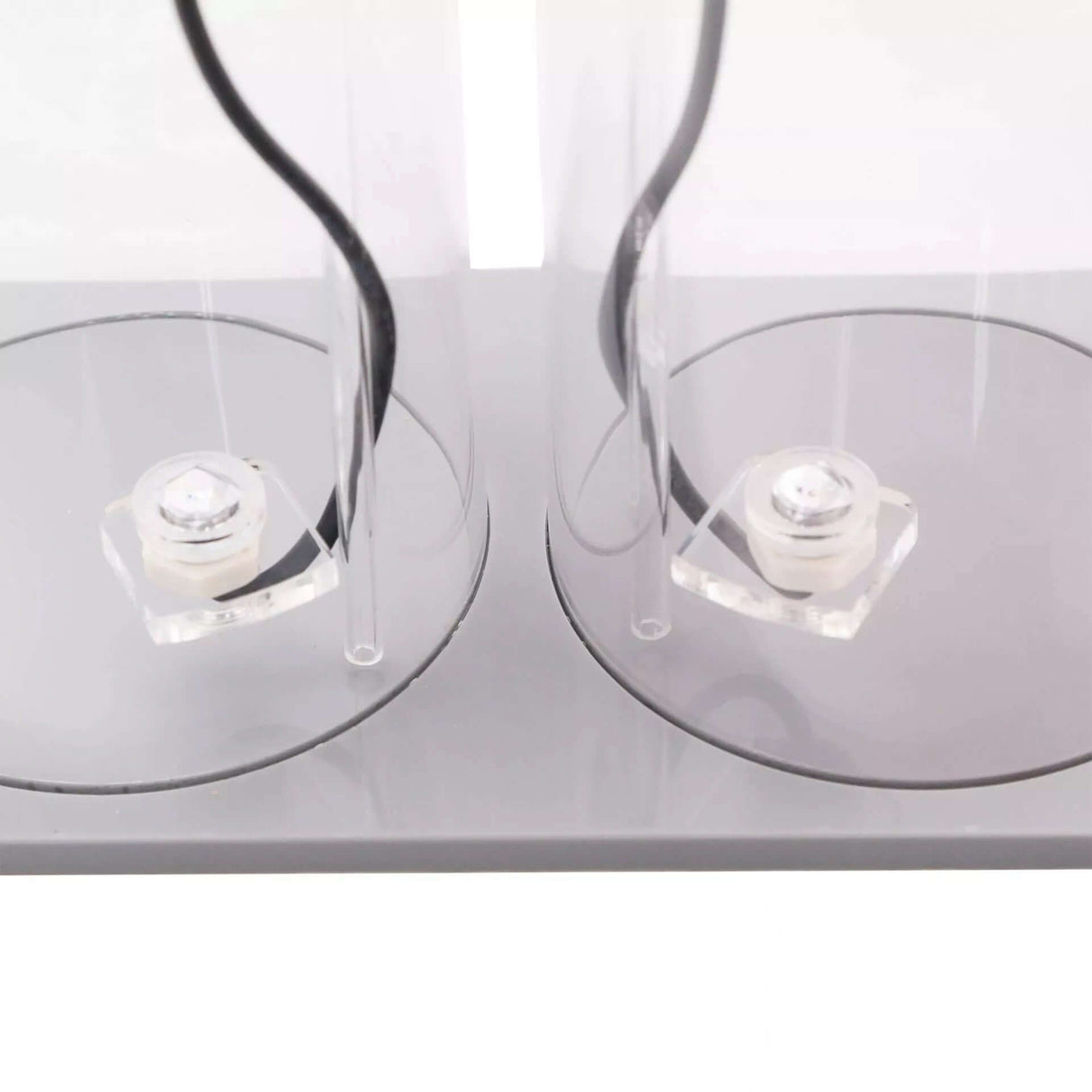 Neptune DOS Dual Reservoir with two transparent vessels and optical sensors for fluid storage.