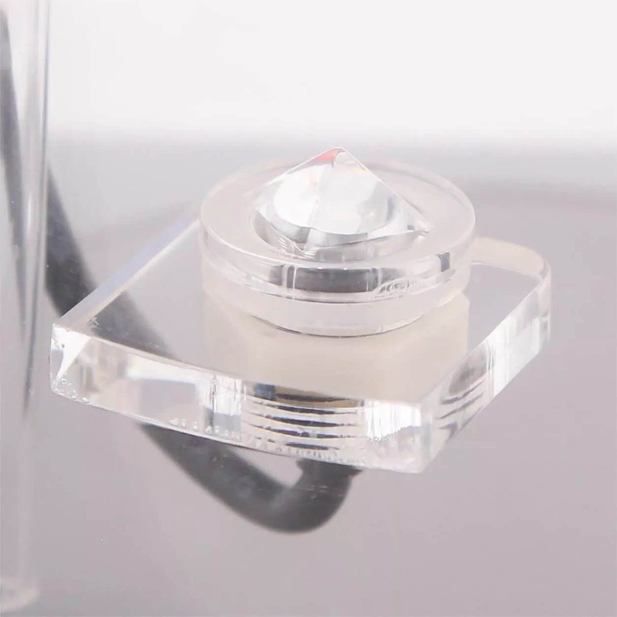 Close-up of Neptune DOS optical sensor, designed for precise liquid detection in dual reservoir systems.