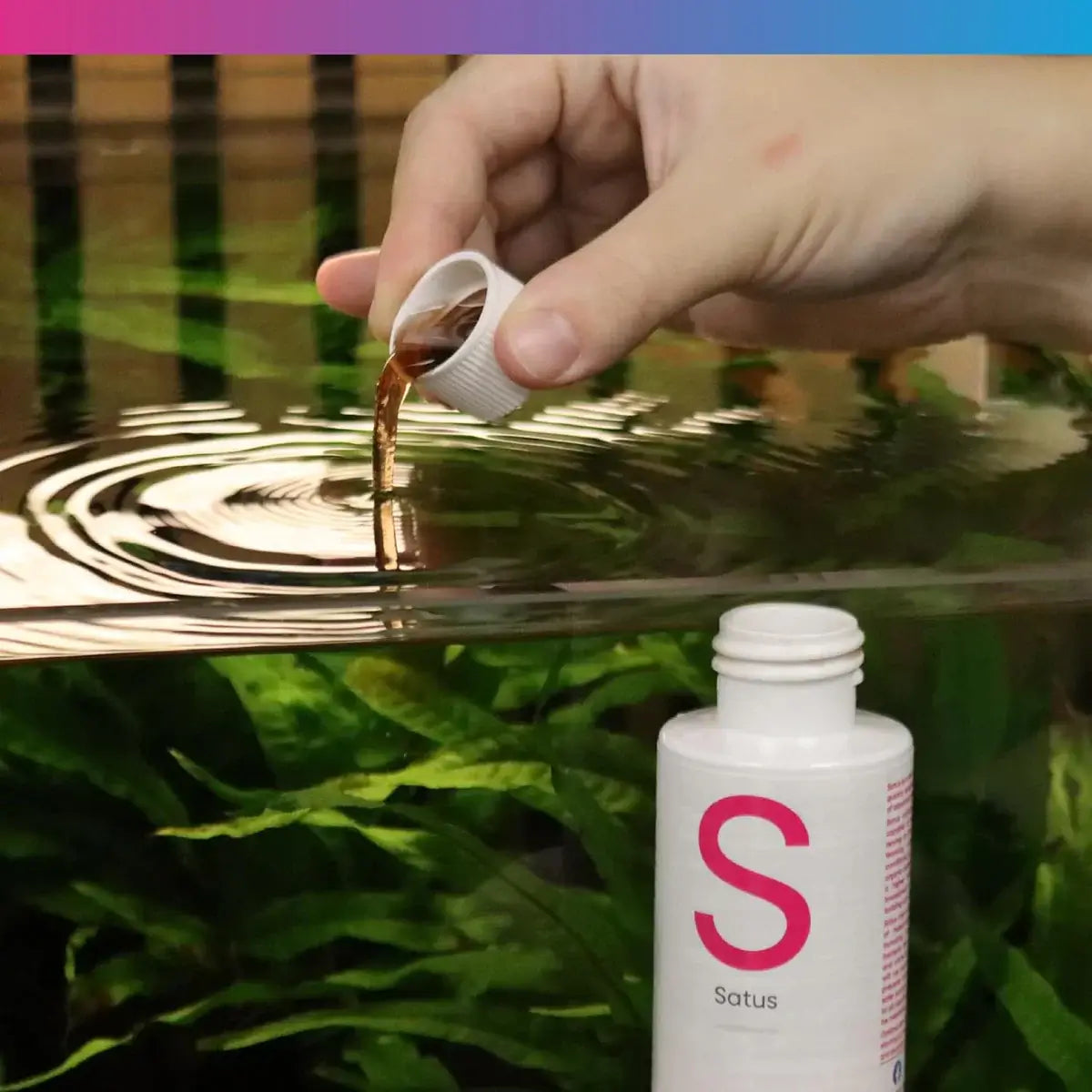 NT Labs Satus Filter Start being poured into an aquarium for accelerated tank maturing.