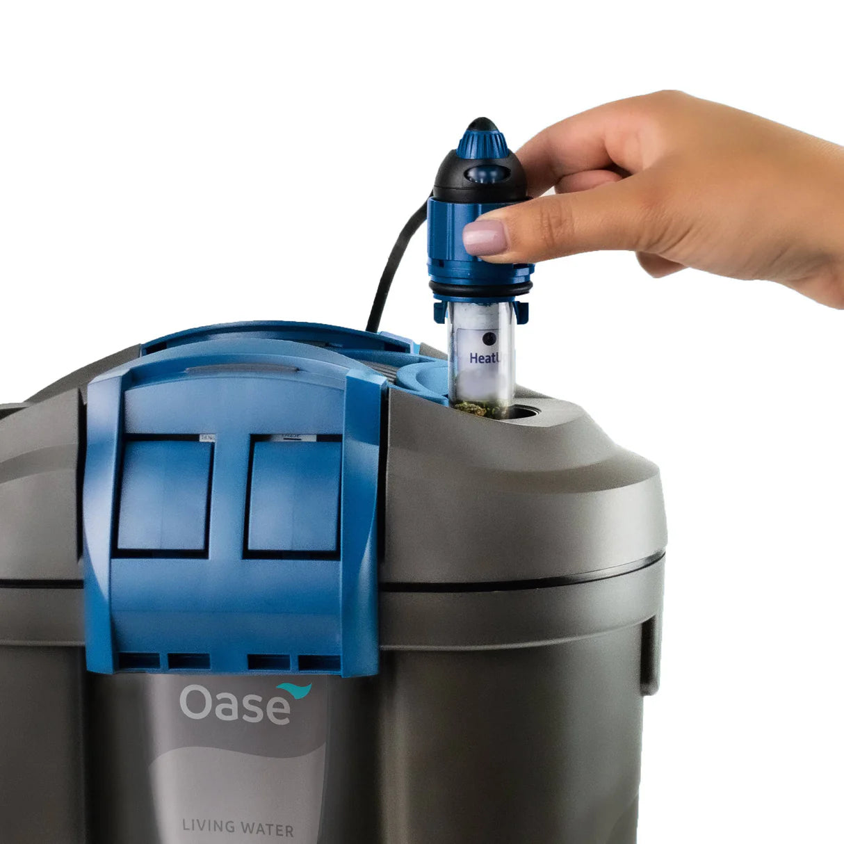 Oase HeatUp aquarium heater installation on water filter with adjustable temperature settings.