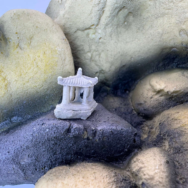 Miniature pavilion on rocky terrain, enhancing aquarium landscapes with realistic textures and natural colors.