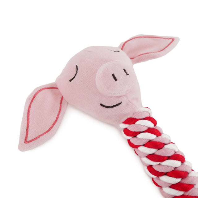 Plush pig in blanket dog toy with rope, designed for playful and engaging dog entertainment.