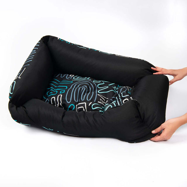 Rogz Graphix Walled Dog Bed with bold patterns and durable fabric, perfect for stylish pet lounging.