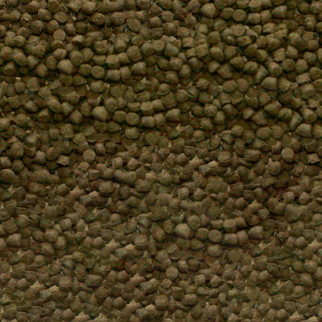 Close-up of Sera Shrimps Nature Food granules, sinking shrimp food with spirulina and willow bark for optimal growth.