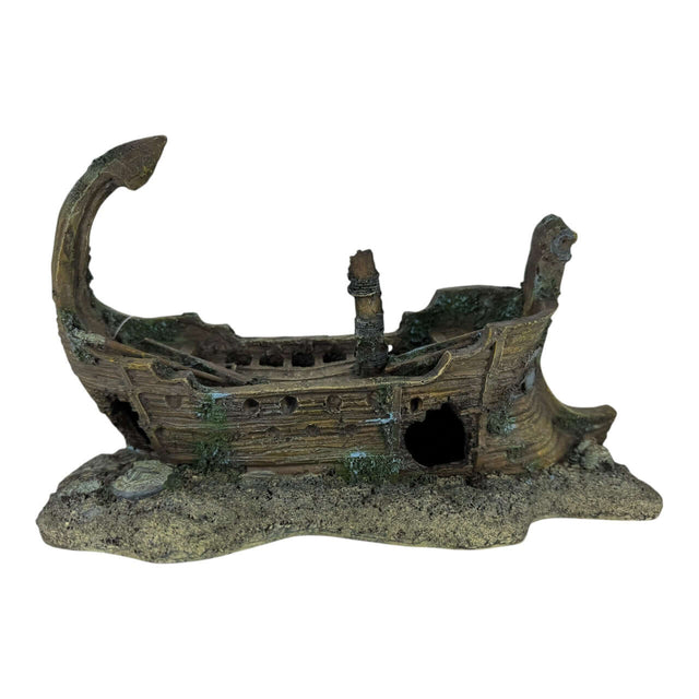 Shipwreck on Rocks Aquarium Ornament resembling a weathered wooden vessel for aquarium decor.