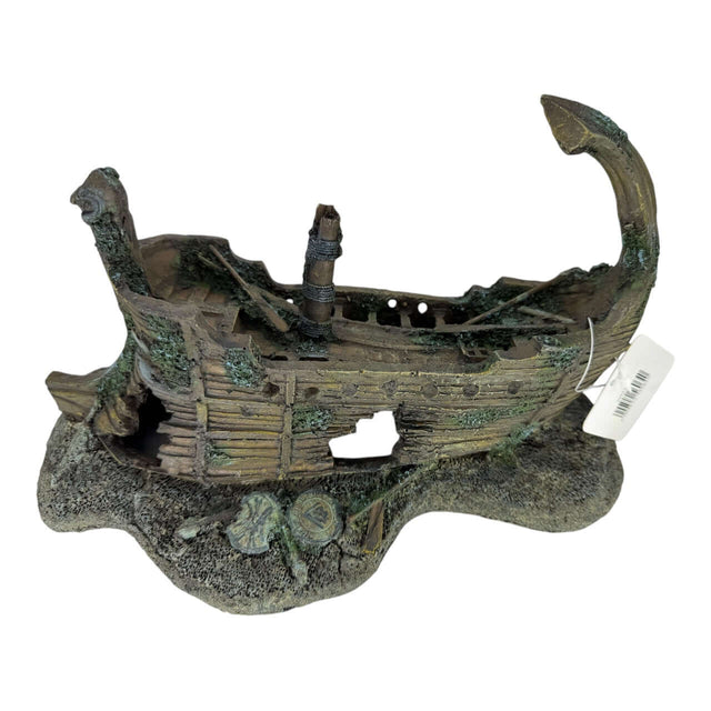 Shipwreck on rocks aquarium ornament with weathered wooden hull and moss detail, perfect for aquatic decor.