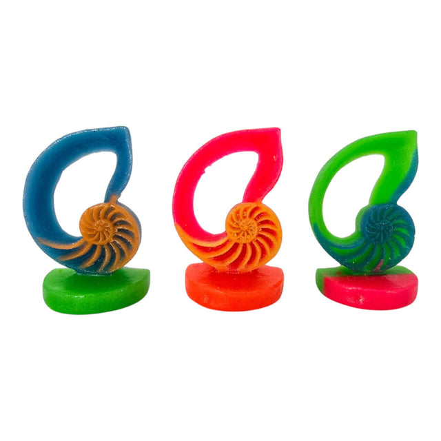 Colorful snail betta aquarium decoration in nautilus shell design with blue, pink, and green colors.