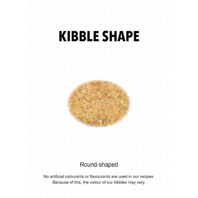 Round-shaped kibble sample for Ultra Dog premium puppy dry food, showcasing natural color without artificial additives.