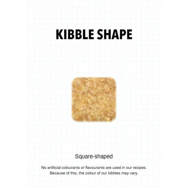 Square-shaped kibble piece for Ultra Dog Superwoof dog food, highlighting natural ingredients and no artificial additives.