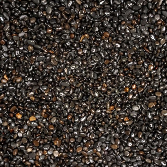 Close-up of UNS Controsand Kona natural black substrate for aquariums and terrariums, safe for aquatic life.