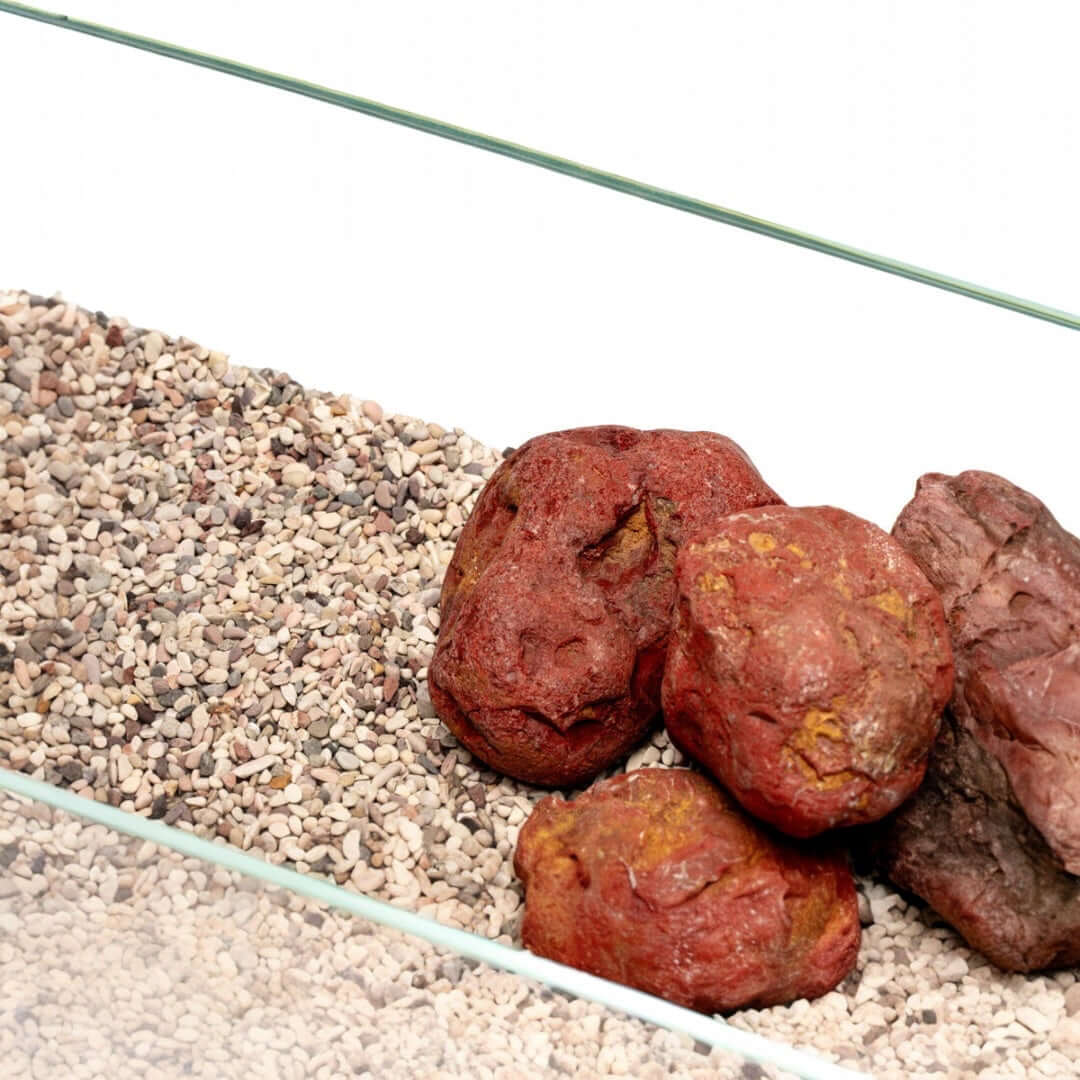 UNS Controsand Tahoe substrate with decorative rocks in a glass aquarium, ideal for freshwater setups.
