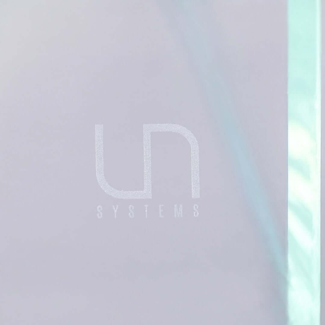 Logo of Ultum Nature Systems showing 'UN SYSTEMS' on a clear background.