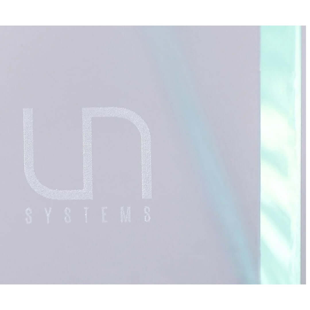 Logo of Ultum Nature Systems on paludarium glass, showcasing quality and design.