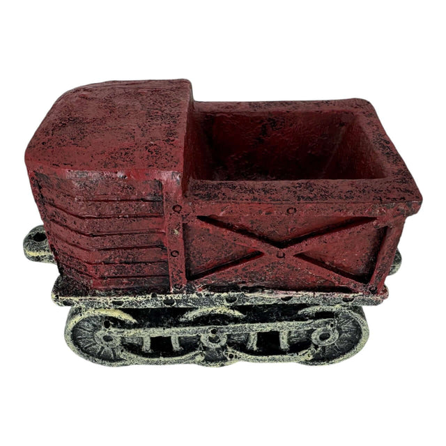 Vintage red train truck aquarium ornament with a textured finish resembling weathered wood.