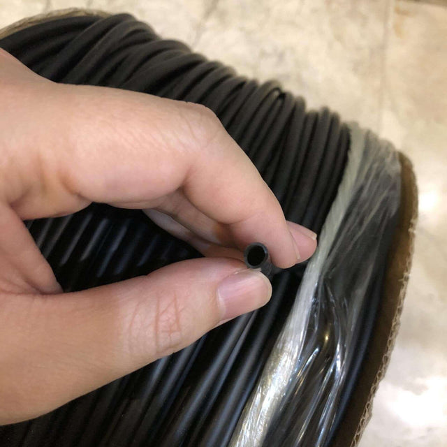 Standard 4/6mm airline tubing by the meter, held in hand, ideal for use with air pumps and stones.