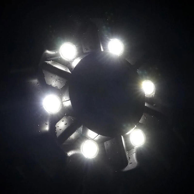 Boyu Floating Fountain Air Pump LED lights illuminating water feature in dark setting. Elegant design and efficient aeration.