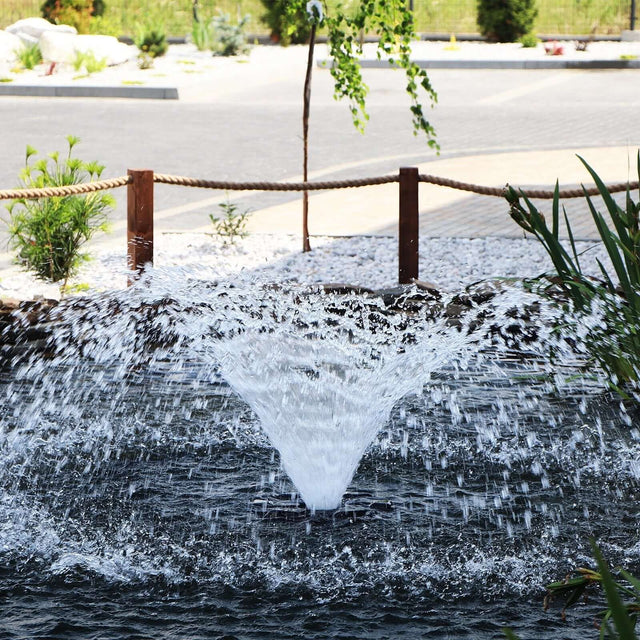Boyu Floating Fountain Air Pump creating a stunning water spray in a serene outdoor setting.