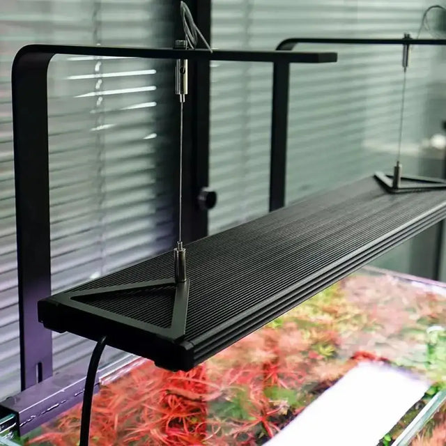 Chihiros Hanging Kit installed above an aquarium, showcasing the WRGB II Slim light system for enhanced aquarium maintenance.