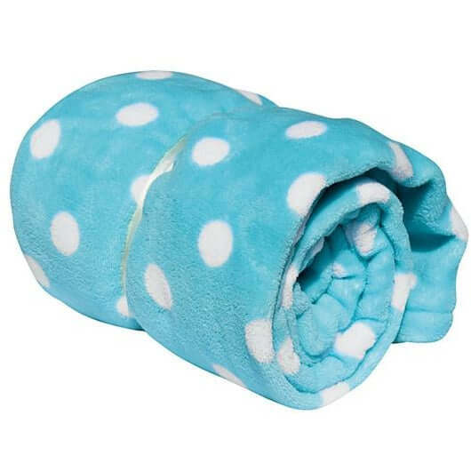 Cozy turquoise coral fleece blanket rolled up with white polka dots for pets' comfort and style.
