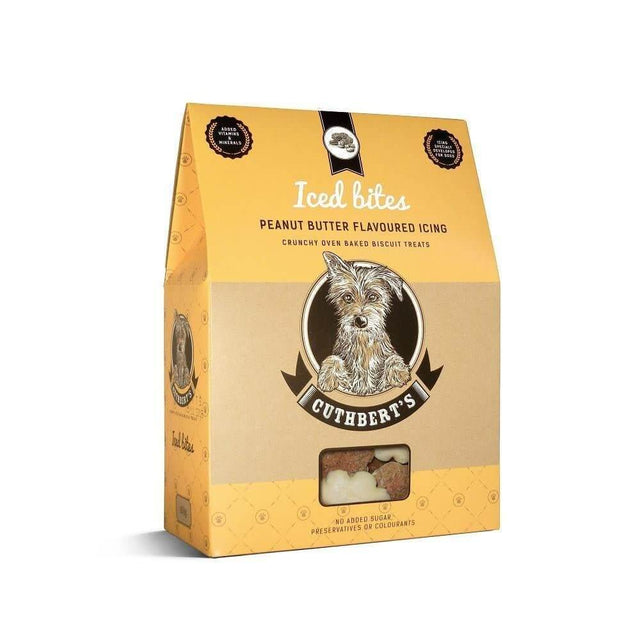 Cuthbert's Iced Dog Biscuits in peanut butter flavor, 650g packaging with crunchy baked treats and icing.