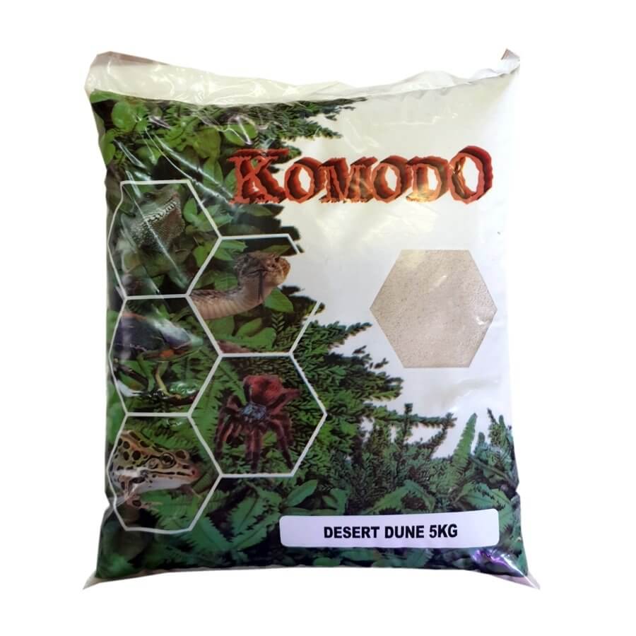 Komodo Desert Dune 5kg white sand for reptiles in packaging with vibrant green background and reptile images.