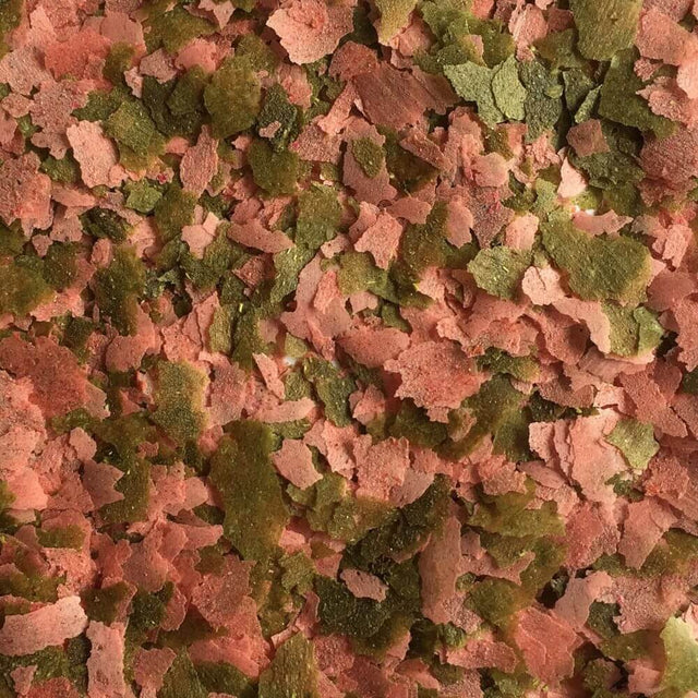 Close-up of Fish Science Goldfish Flakes featuring vibrant colors from spirulina, shrimp, and purple carrot for enhanced fish nutrition.