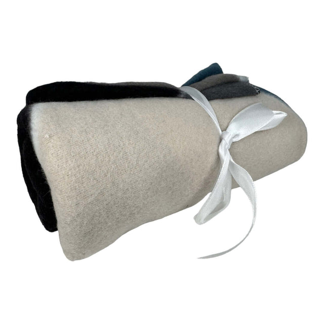 Rolled fleecy pet blanket with a tied ribbon, available in assorted colors and designs, size 750 x 750mm.