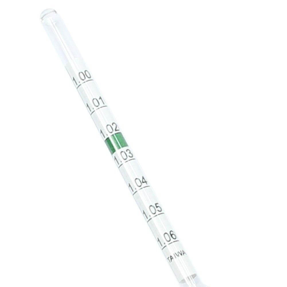 Floating glass hydrometer with thermometer showing precise measurements for aquarium water conditions.