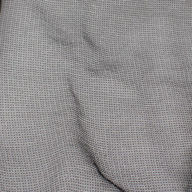 close-up of textured gray fabric with a woven pattern, showcasing its durable and versatile design.