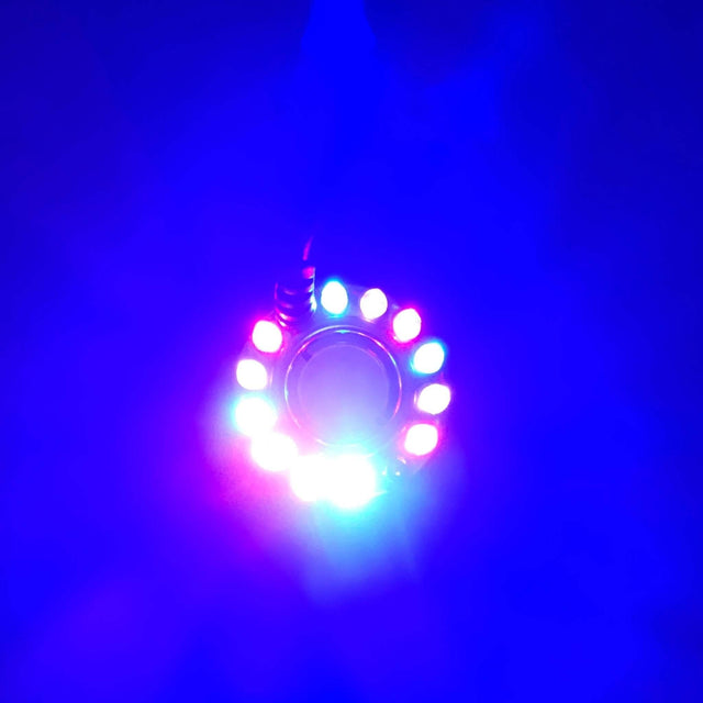 Colorful LED lights arranged in a circle emitting vibrant blue, red, and green hues, creating a mystical ambiance.