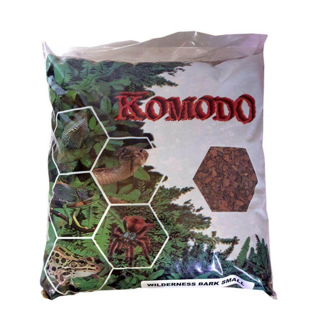 Komodo Wilderness Bark Landscape Media 1kg package for reptile substrate, featuring natural bark and lush green background.