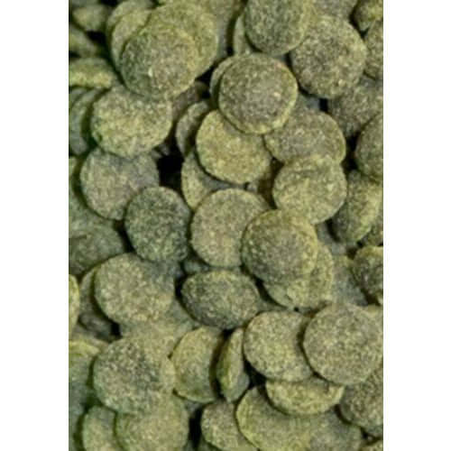 Close-up of Ocean Nutrition shrimp wafers, green round pellets designed for freshwater shrimp feeding.