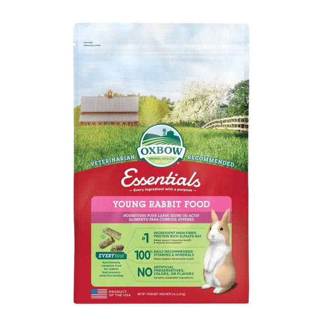 Oxbow Essentials Young Rabbit Food package with farm backdrop, designed for healthy growth and digestion in young rabbits.