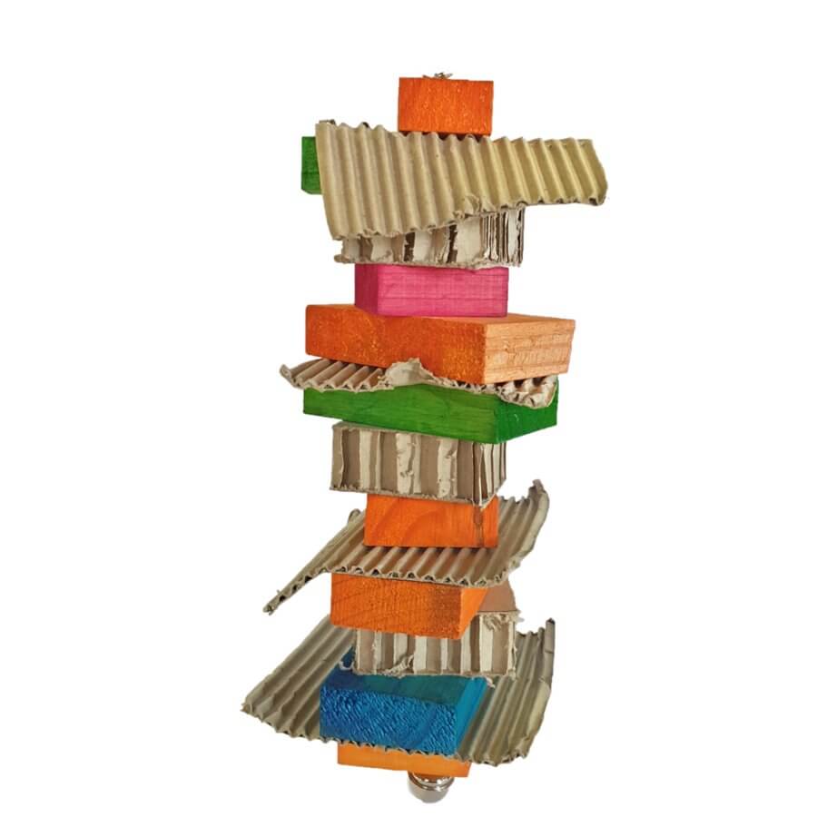 Colorful parrot shredding toy with stacked cardboard and wooden pieces for parrot play and enrichment.