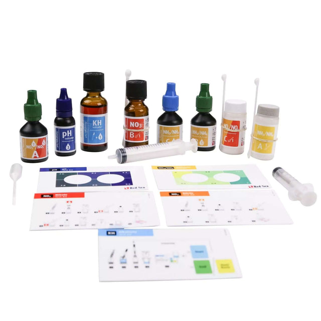 Red Sea Marine Care Test Kit components including test liquids, syringes, and instructions for monitoring aquarium levels.
