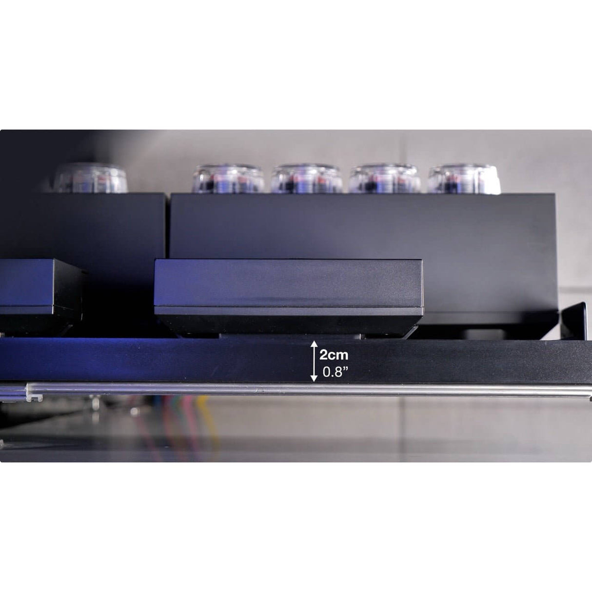 Red Sea Slide Out Control Panel installation showing measurement scale, designed for easy access to aquarium equipment.