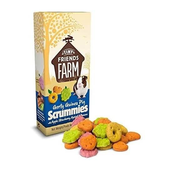 Tiny Friends Gerty Scrummies 120g for guinea pigs, colorful treats in a box with cartoon guinea pig illustration.