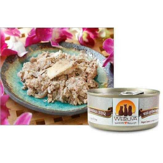 Weruva Polynesian BBQ Wet Cat Food on a plate with flowers, featuring grain-free sardine and tuna ingredients.