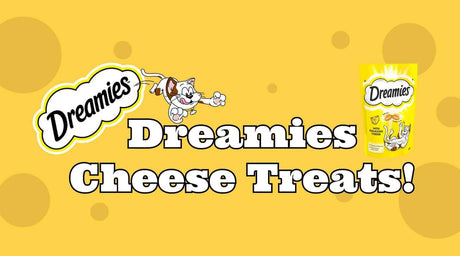 Dreamies Cheese Treats packaging with playful cat illustration on a vibrant yellow background.