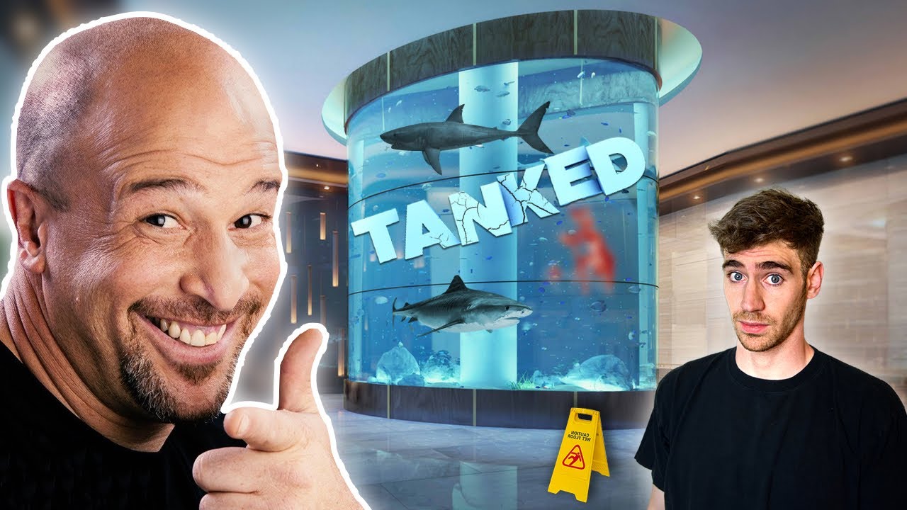 Brett Raymer and a colleague in front of a stunning aquarium with the word 'Tanked' displayed prominently.